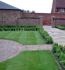 Image: Garden maintained by Luke Harrison, including walling and fencing repair.